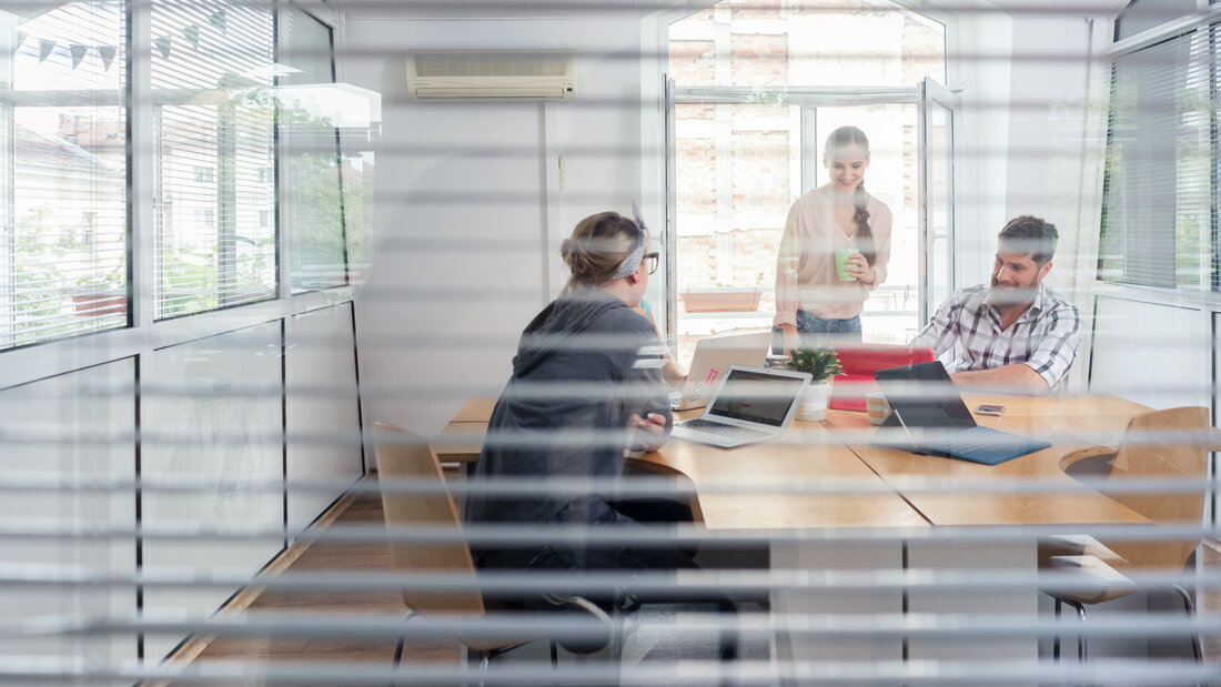 young independent workers sharing the facilities of a modern co-working space